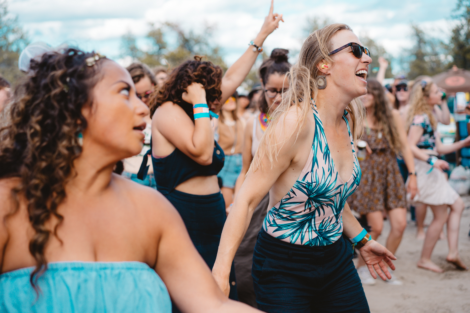 Two women dance in the crowd at the 2019 Folk On The Rocks Festival